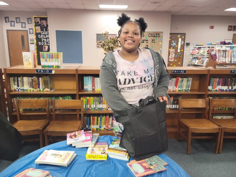 Student with new books